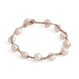 Rhine - String freshwater pearl bracelet (Tan string, apricot pearls)